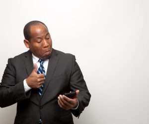 African American Business Man Giving Thumb Up Via Phone How to save money with NaYa when I transfer funds